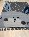 Harlow Bespoke Gray Hand Tufted Wool Rug, a subtle and luxurious gray wool rug with a contemporary abstract pattern, adds warmth and texture to a bright, modern living space.