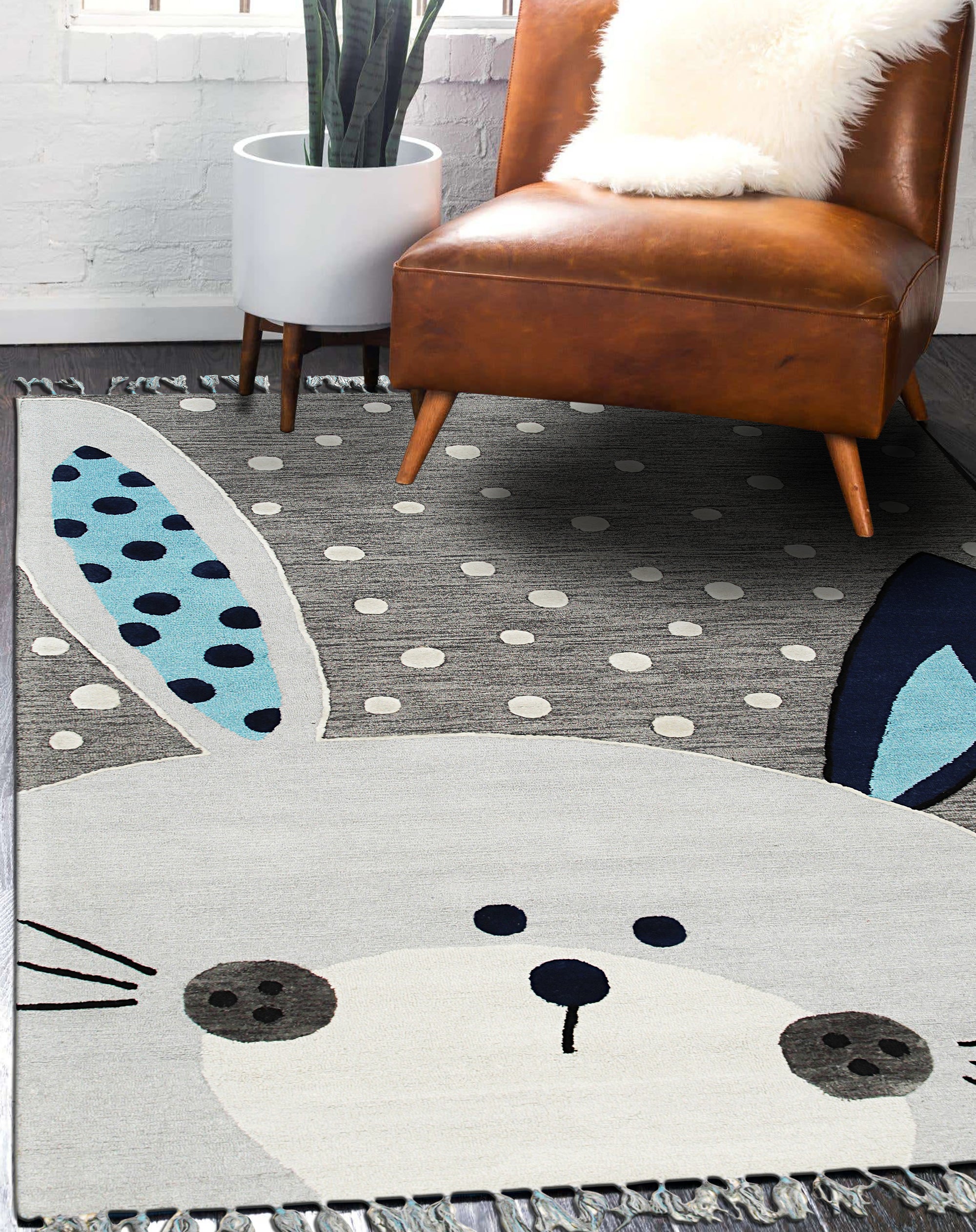 Harlow Bespoke Gray Hand Tufted Wool Rug, a textured expanse of soft gray wool, grounding a bright, airy living room with a modern design.