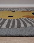 Lush Graceful Gray Hand Tufted Wool Rug displayed in a warmly lit living room setting. Gray hand-tufted wool rug anchors the space beneath a modern coffee table, showcasing its soft texture and graceful design.