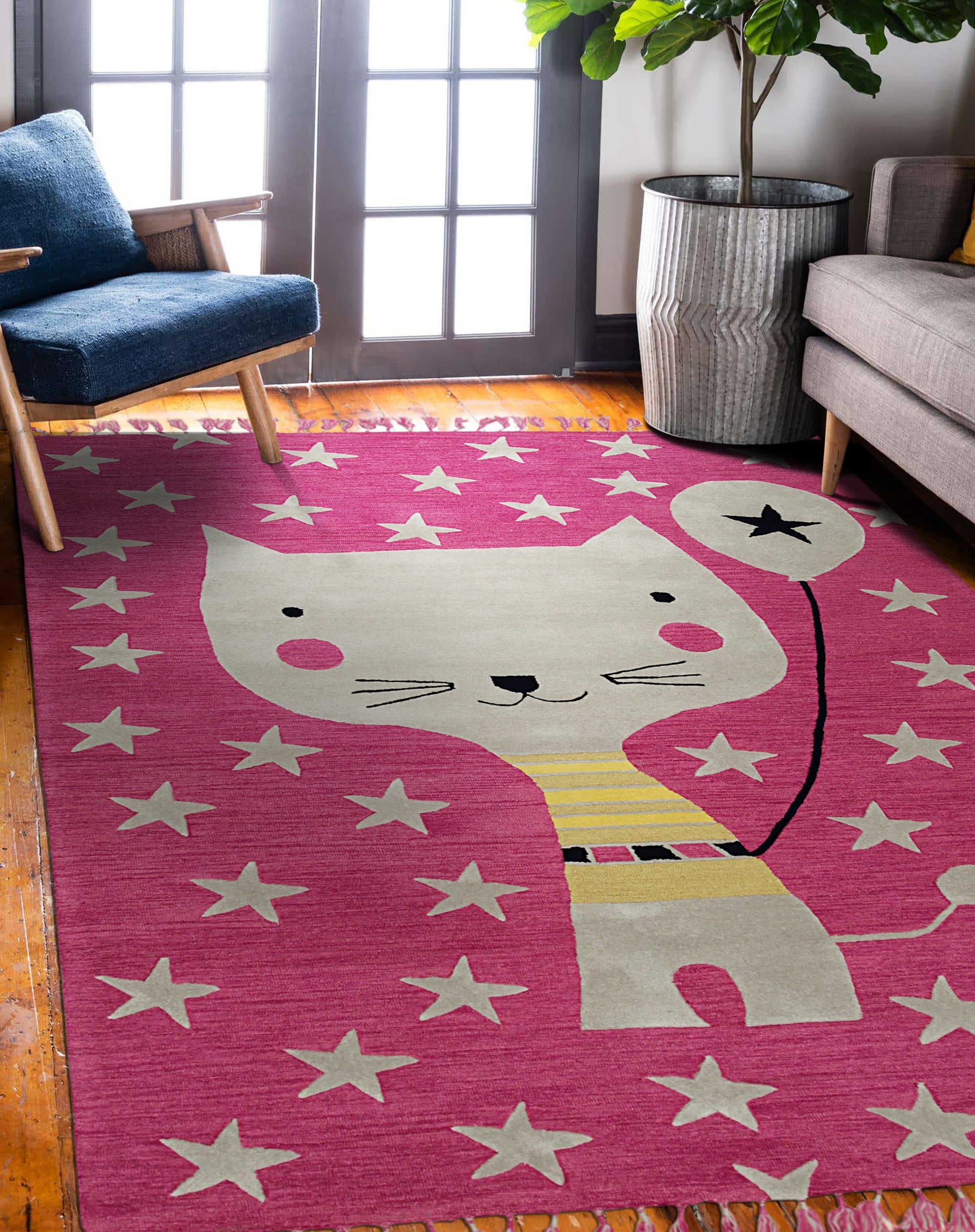 Iris Laine Pink Hand Tufted Wool Rug, its soft pink wool creating a warm, inviting atmosphere within a bright, modern living room setting.