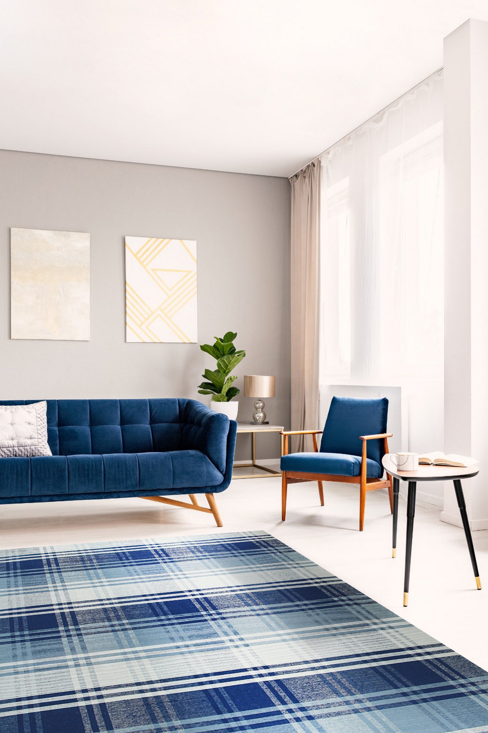 Sophisticated Elegant Blue Flatweave Wool Rug, showcasing a serene living room scene. Light wood floors complement the rug's cool blue tones and subtle geometric pattern. The flatweave wool texture adds a layer of understated elegance to the space.