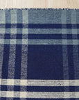 Sophisticated Elegant Blue Flatweave Wool Rug, its cool blue tones and flatweave construction anchoring a brightly lit living room.