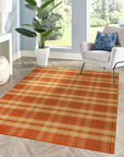 Cassandra Stylish Orange Flatweave Wool Rug, vibrant geometric patterns dance across a close-up view, revealing the rug's texture and intricate weave.