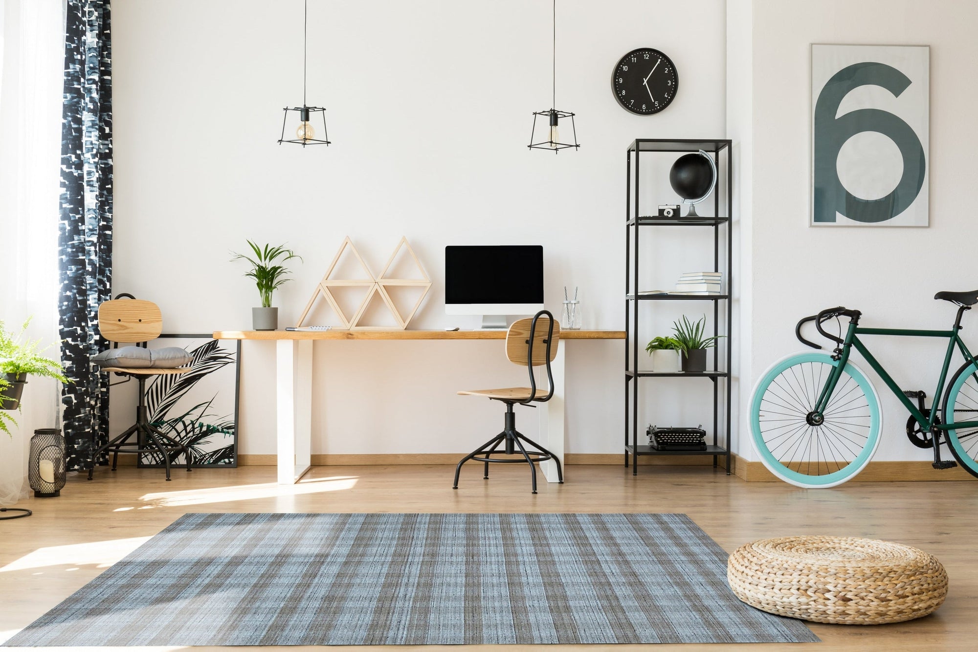 Serene Chloe Beige Flatweave Wool Rug graces a bright living room, its subtle pattern complementing the light wood floor and minimalist furniture. Beige wool fibers create a warm, inviting texture underfoot.