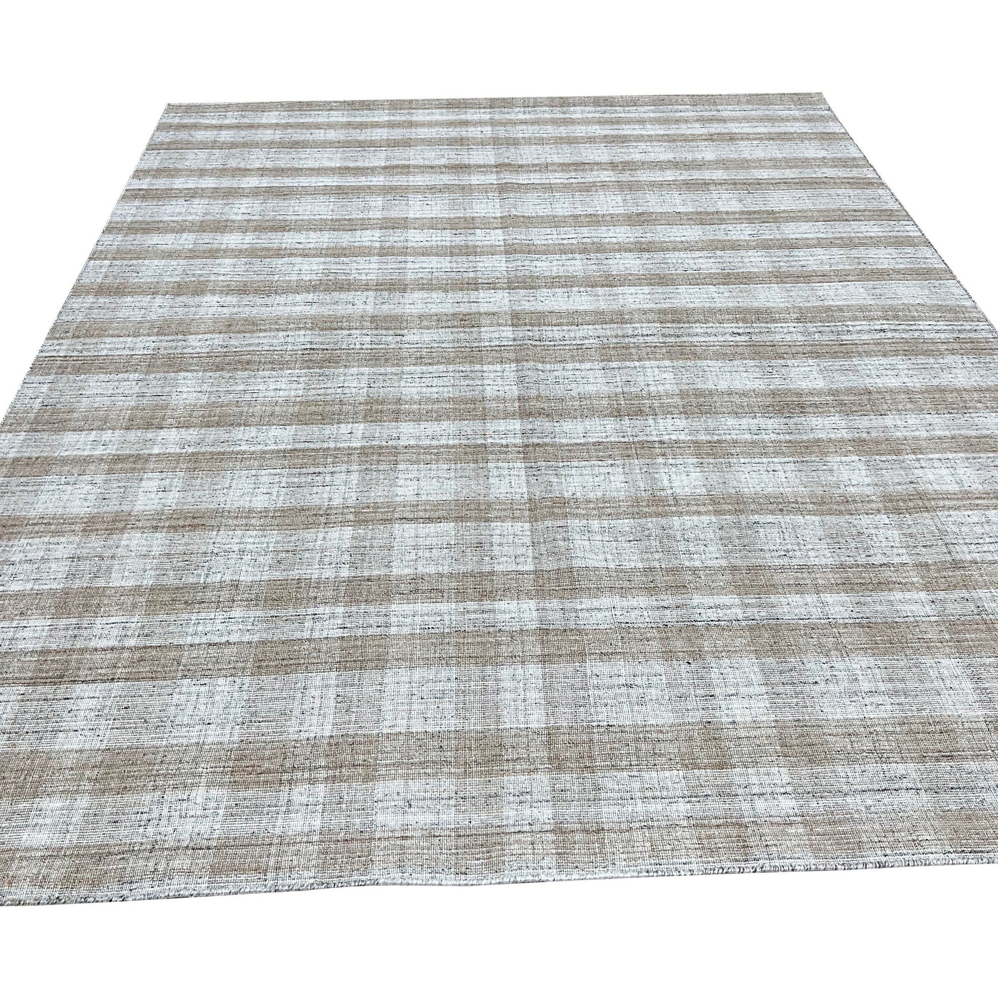 Serene Chloe Beige Flatweave Wool Rug, a neutral-toned flatweave wool rug with subtle texture, displayed in a bright, modern living room setting.