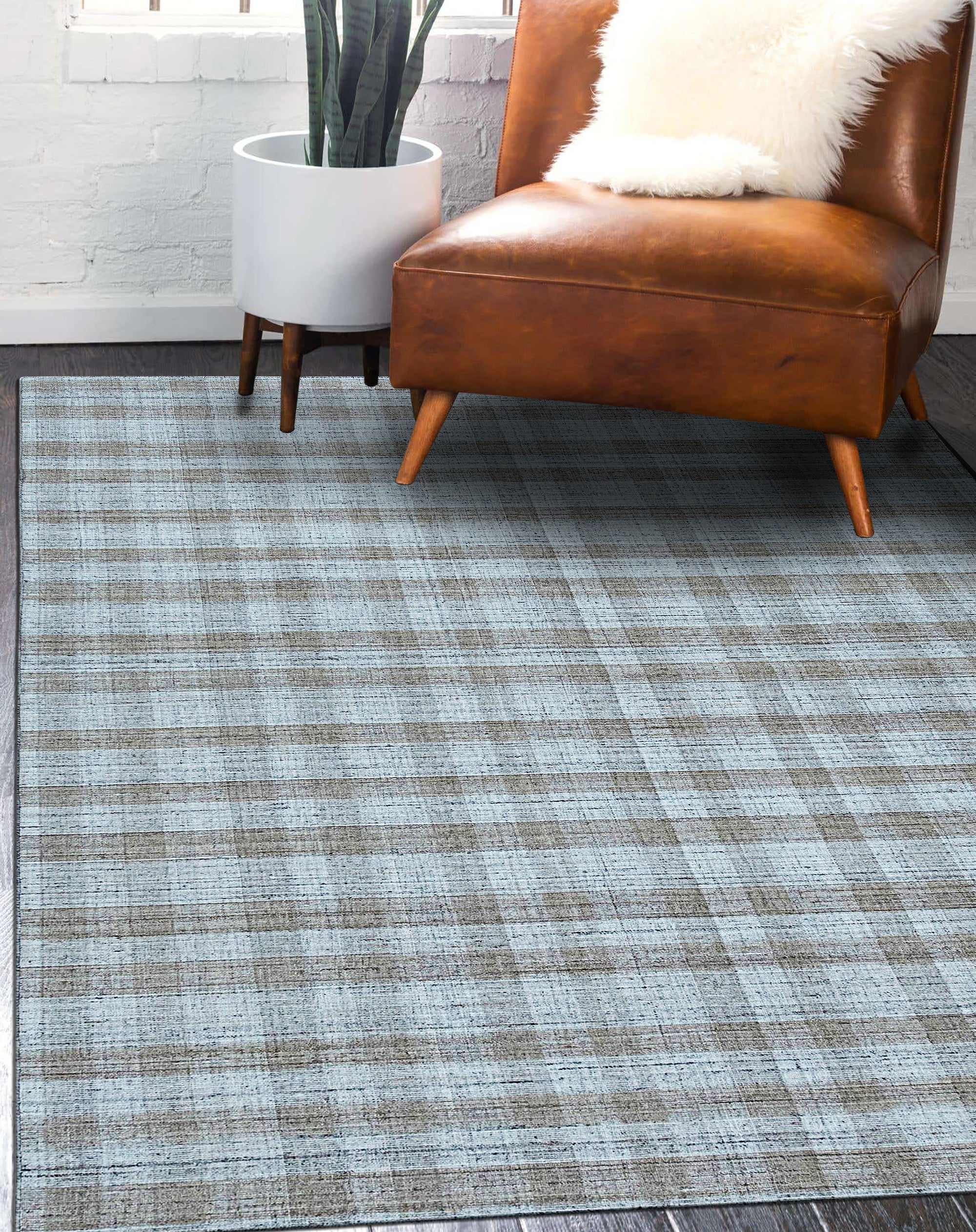Serene Chloe Beige Flatweave Wool Rug, shown in a warmly lit living space, its neutral tones and subtle texture complementing modern furniture and creating an inviting atmosphere.