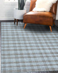 Serene Chloe Beige Flatweave Wool Rug, shown in a warmly lit living space, its neutral tones and subtle texture complementing modern furniture and creating an inviting atmosphere.