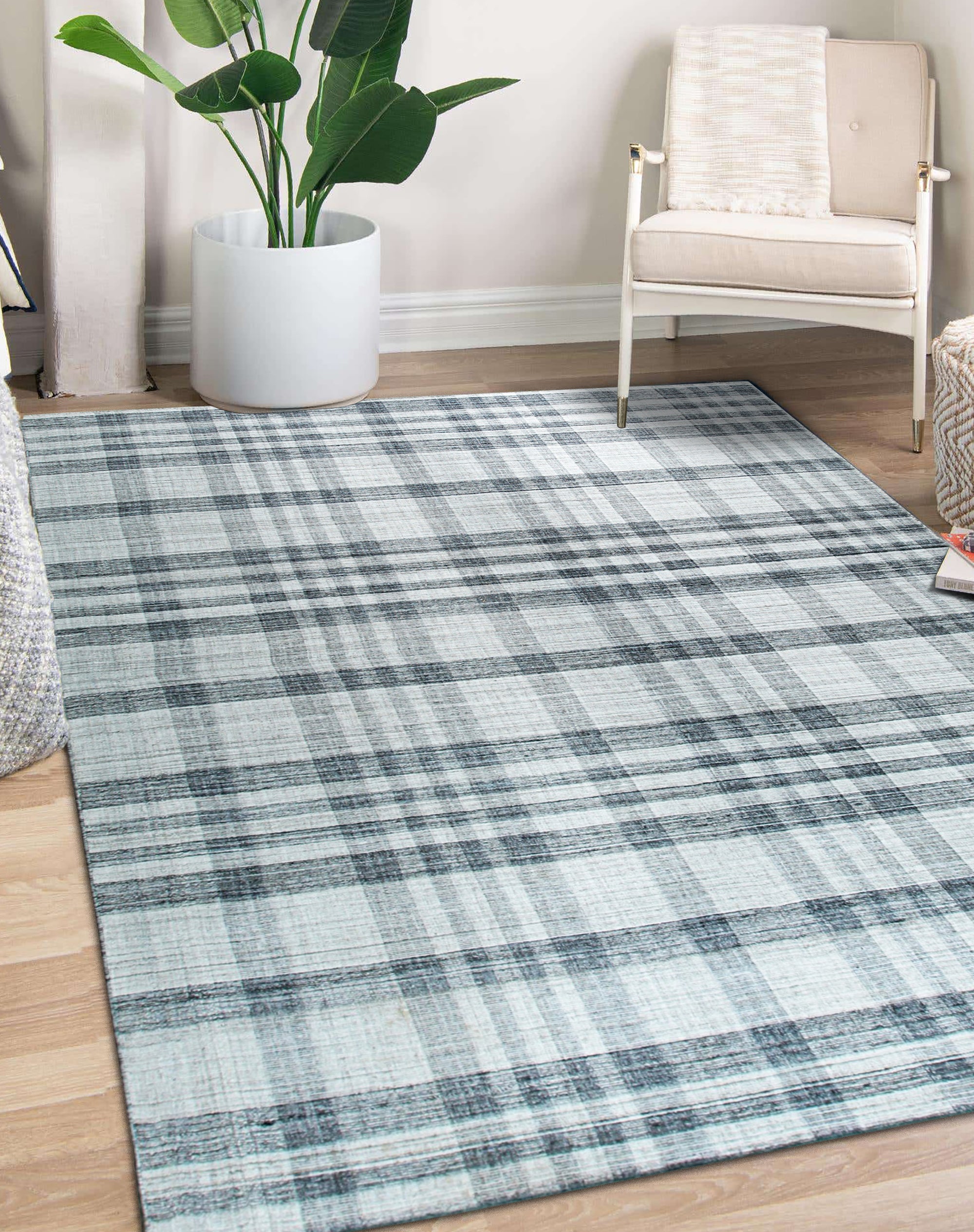 Jasmine Stylish Gray Flatweave Wool Rug in a bright, contemporary living room; showcasing a subtle geometric pattern, its flatweave construction lending a modern, understated elegance to the space.