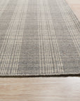 Classic Radiant Gray Flatweave Wool Rug displayed in a living room setting; its flatweave construction showcases subtle gray variations, complementing the modern furniture.