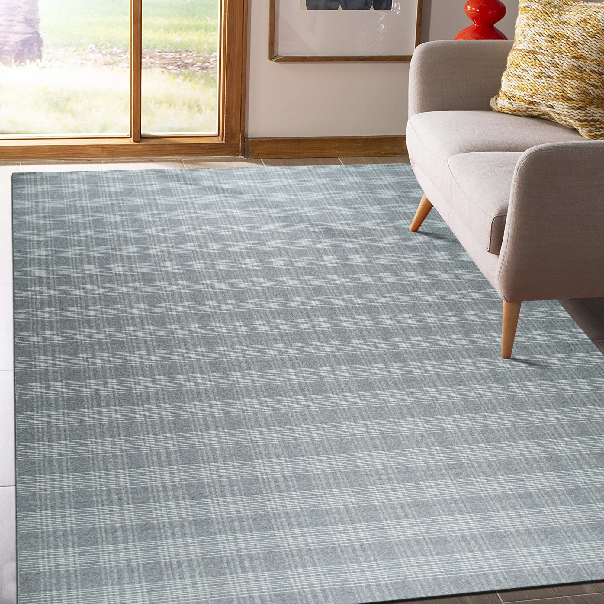 Classic Radiant Gray Flatweave Wool Rug, showcases a subtly textured, gray flatweave design, lending sophisticated warmth to a modern living space.