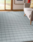 Classic Radiant Gray Flatweave Wool Rug, showcases a subtly textured, gray flatweave design, lending sophisticated warmth to a modern living space.