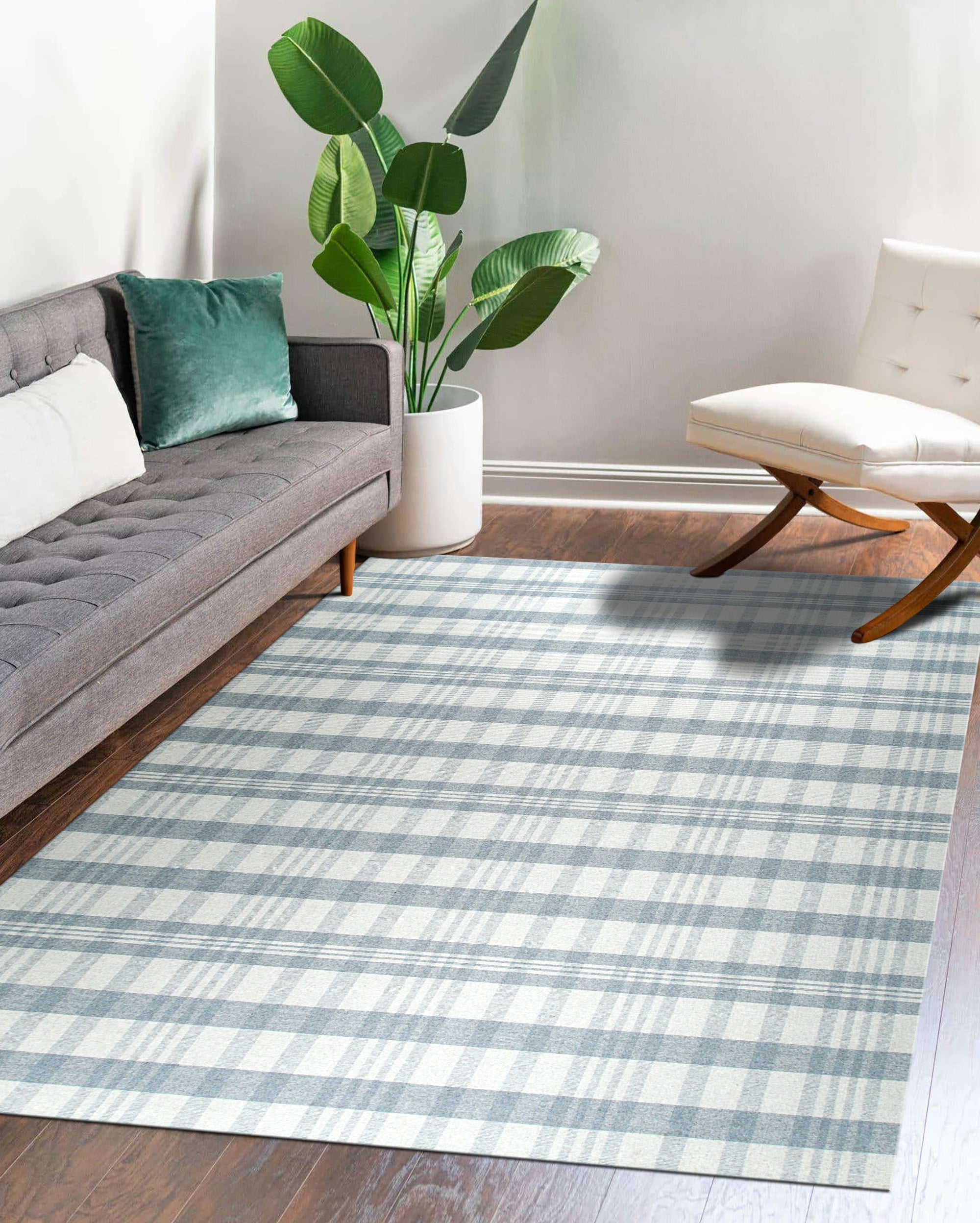 Handcrafted Vibrant Gray Flatweave Wool Rug, showcasing a soft, textured gray wool construction with subtle variations in tone, filling a modern living room space with warmth and understated style.