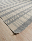 Handcrafted Vibrant Gray Flatweave Wool Rug, a textured gray wool rug with a flatweave construction, displayed in a living room setting.