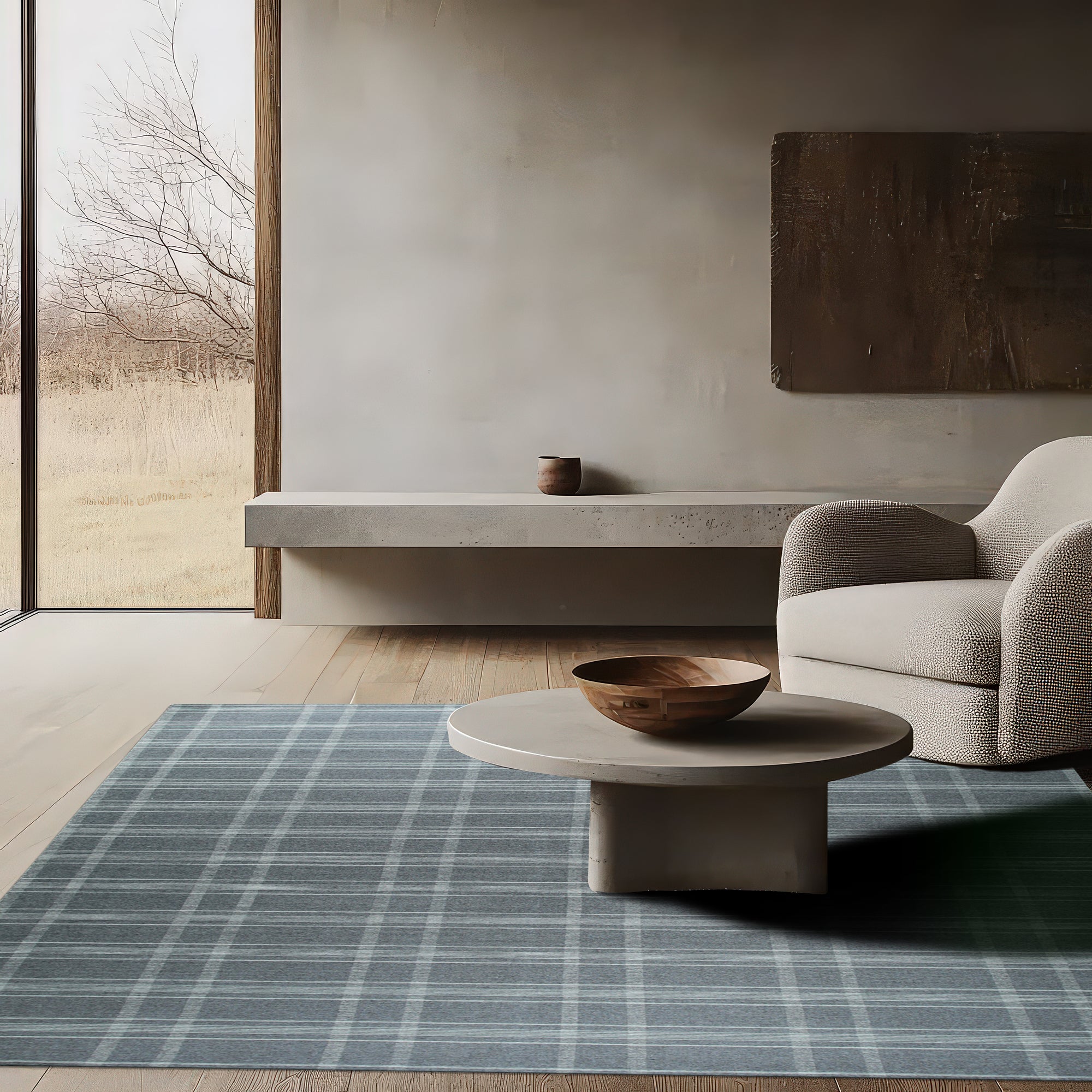 Graceful Quinn Gray Flatweave Wool Rug, a subtly textured gray wool rug with a modern, minimalist design, sits elegantly on a light wood floor, complementing the clean lines of the contemporary space.