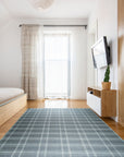 Graceful Quinn Gray Flatweave Wool Rug, showcasing its subtle geometric pattern and flatweave construction in a bright, modern living room setting.