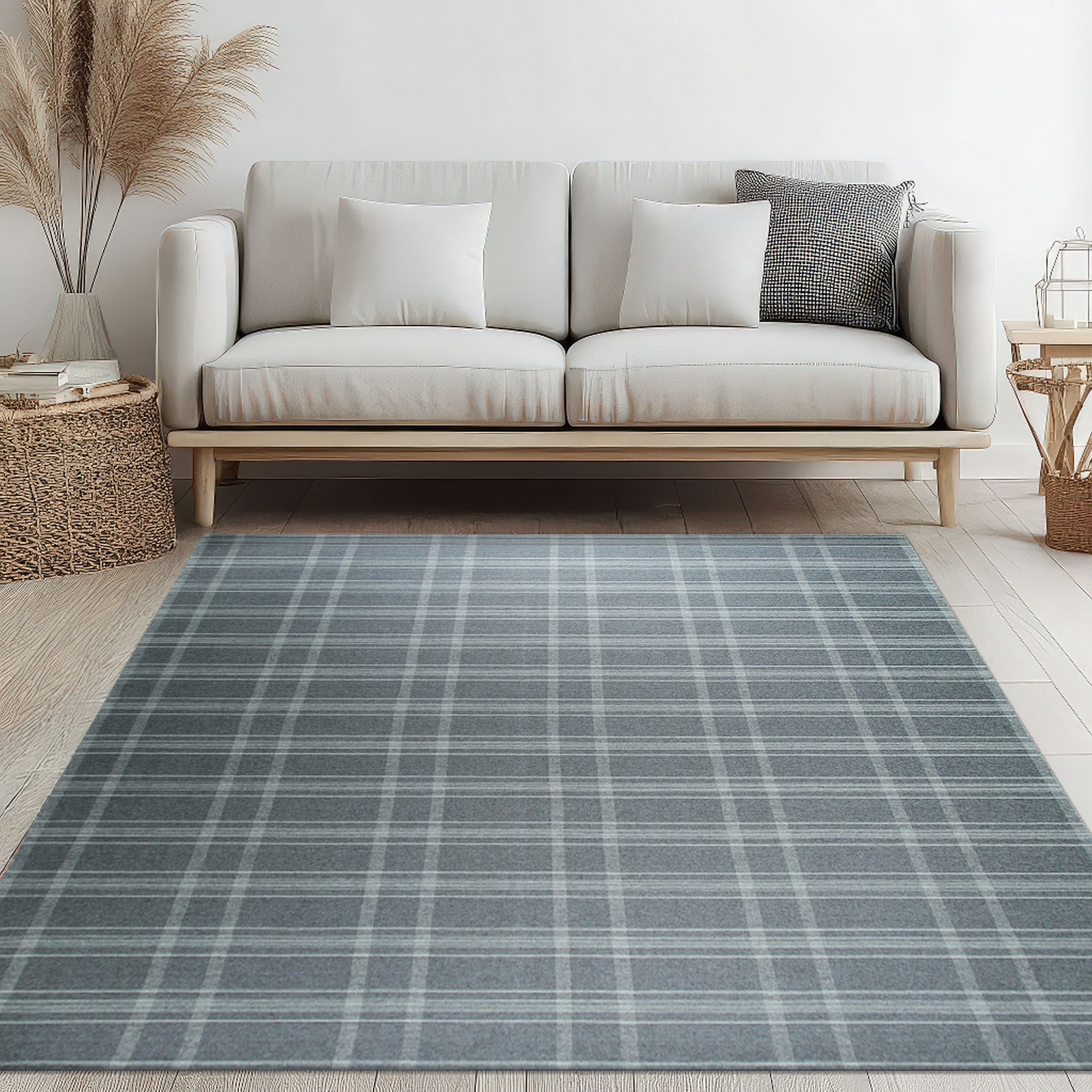 Graceful Quinn Gray Flatweave Wool Rug, showcasing its versatile gray tones and flatweave construction in a bright, modern living room setting with light wood floors.