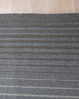 Timeless Comfortable Gray Flatweave Wool Rug, warm gray tones and subtle textural variations define this durable flatweave wool rug, subtly textured and inviting in a comfortable living space.