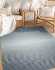 Timeless Comfortable Gray Flatweave Wool Rug, textured gray wool flatweave seen in a bright, modern living room setting.