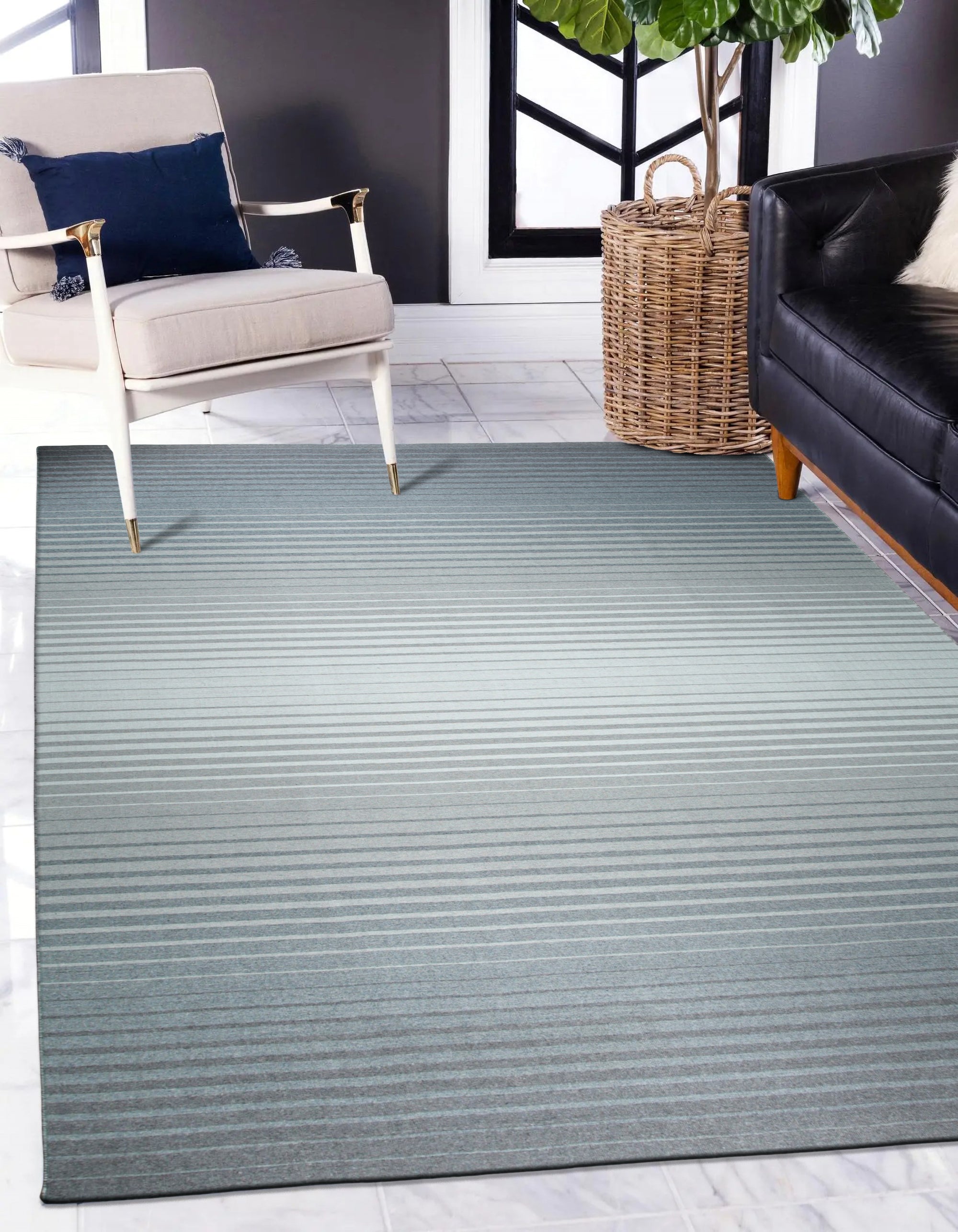 Timeless Comfortable Gray Flatweave Wool Rug anchors a modern living space, its subtle gray tones complementing light wood floors and crisp white walls. The flatweave construction is evident, showcasing a smooth, low-profile texture. Natural light highlights the rug's warmth and inviting comfort.