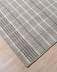 Timeless Celia Gray Flatweave Wool Rug, subtle patterns dance across soft gray wool, enhancing a bright living space with a modern, inviting texture.