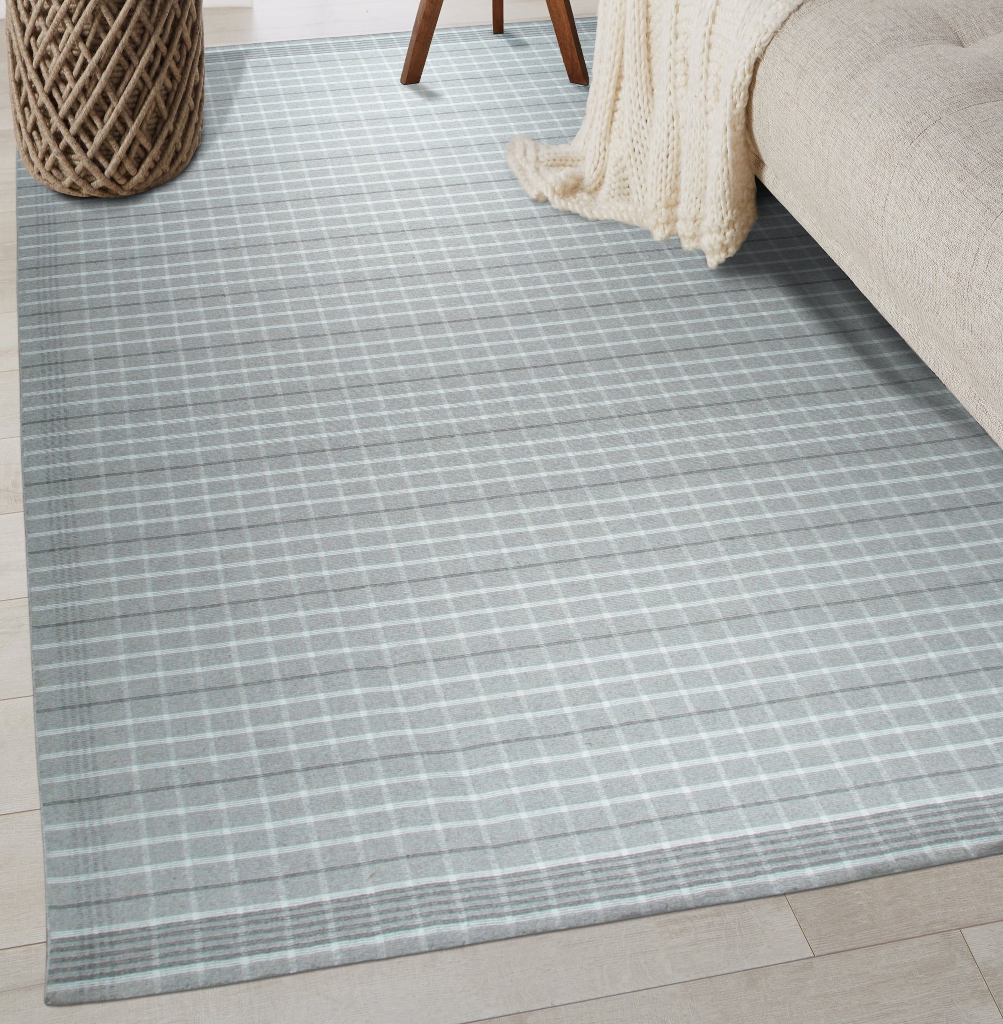 Here's the alt text based on the provided information:
 
 Timeless Celia Gray Flatweave Wool Rug, a sophisticated gray wool rug with a subtle, textured flatweave, complements a modern living space with its understated elegance and timeless appeal.