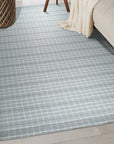 Here's the alt text based on the provided information:
Timeless Celia Gray Flatweave Wool Rug, a sophisticated gray wool rug with a subtle, textured flatweave, complements a modern living space with its understated elegance and timeless appeal.