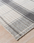 Lila Bianca Gray Flatweave Wool Rug, its subtle gray tones and flatweave construction displayed in a bright, inviting living space.