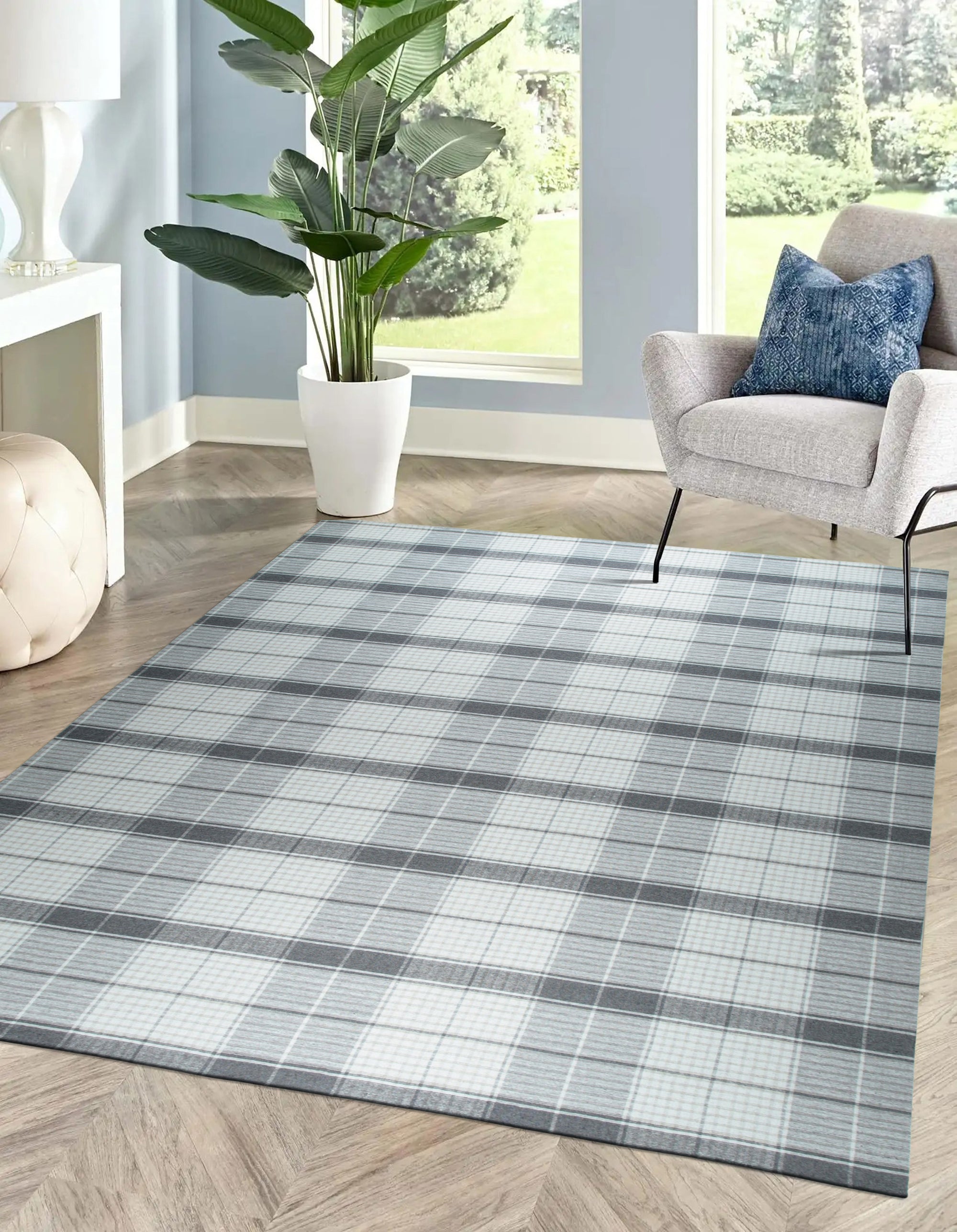 Lila Bianca Gray Flatweave Wool Rug, showcasing a textured gray and ivory design in a bright, modern living space.