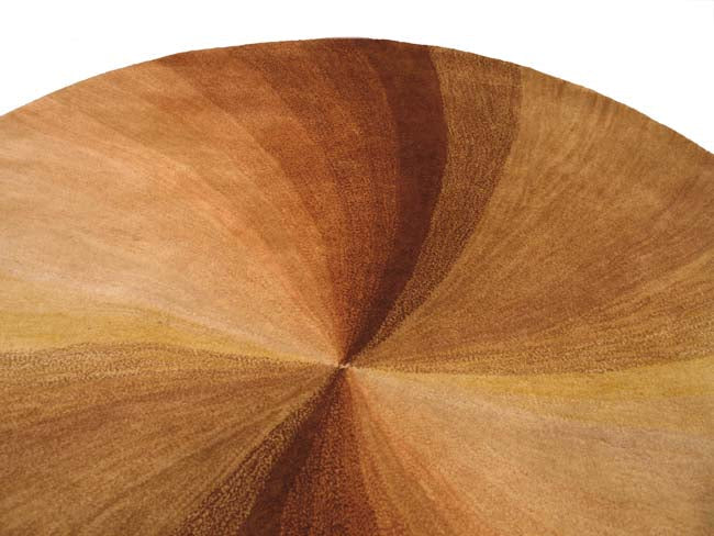 Ava Trendy Light Brown Hand Tufted Wool Rug, showcasing its textured wool pile and subtle pattern in a bright, modern living room setting.