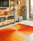 Versatile Sleek Orange Hand Tufted Wool Rug, its warm orange hue illuminating a modern living space with hardwood floors and a glimpse of a patterned armchair, showcasing its ability to complement contemporary decor.