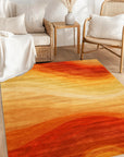 Classic Vibrant Orange Hand Tufted Wool Rug, showcasing its warm orange hue and soft, hand-tufted texture, lies gracefully on a light wooden floor, adding a pop of color and comfort to a brightly lit space.