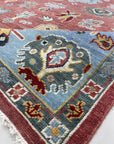 Mira Traditional Rust Hand Knotted Wool Rug, richly patterned rust and cream wool rug hand-knotted with an intricate traditional design, displayed in a well-lit room setting.