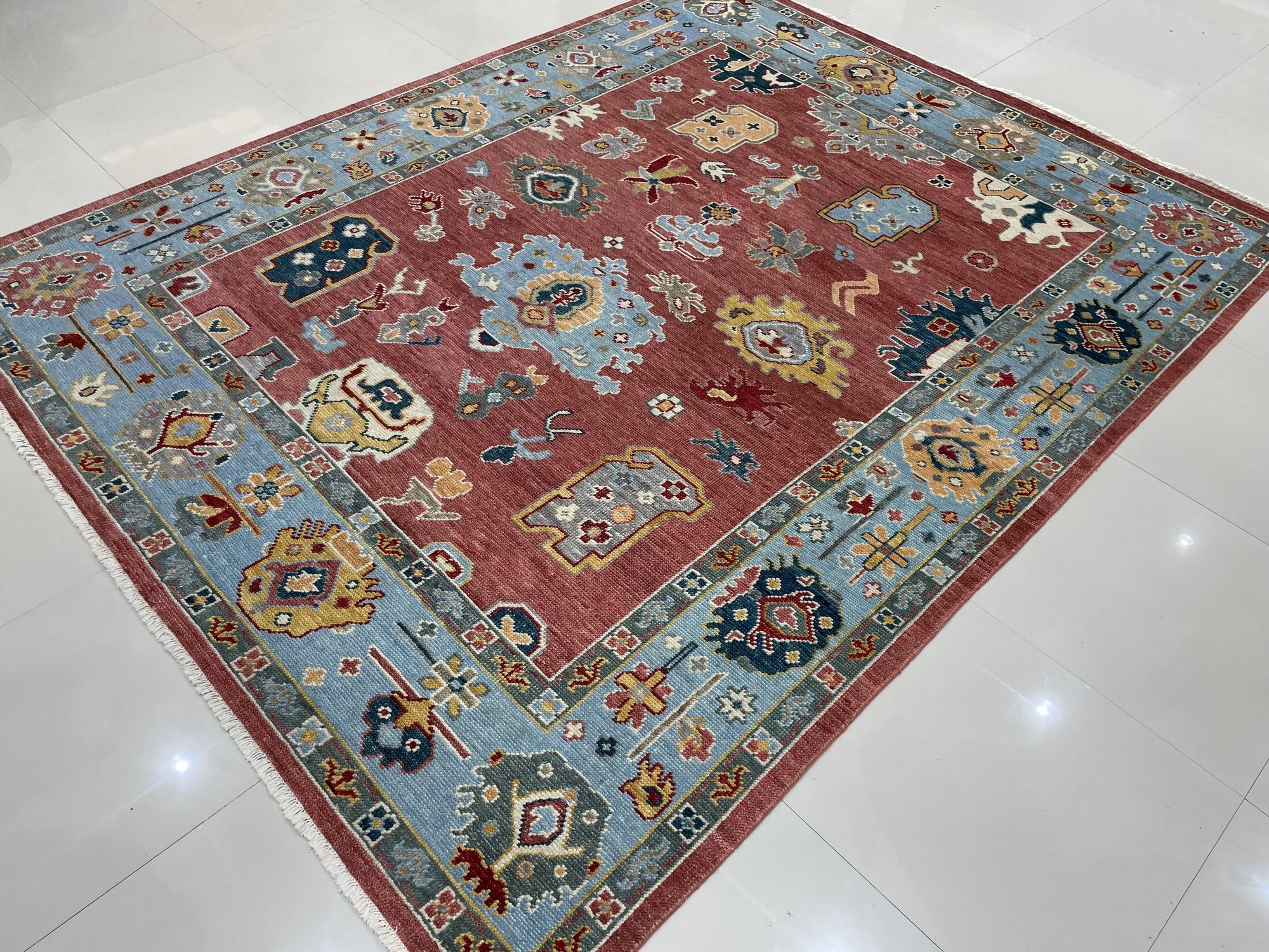 Mira Traditional Rust Hand Knotted Wool Rug, showcasing a detailed, warm rust-toned pattern. The hand-knotted construction and intricate design details are clearly visible, highlighting its traditional style.