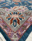 Unique Rustic Blue Hand Knotted Wool Rug, displaying rich blue hues and rustic textures, hand-knotted wool construction visible within a staged living space.