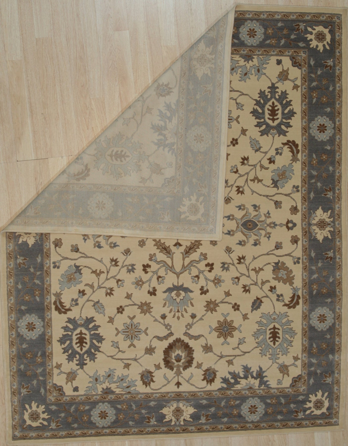 Opulent Oushak Ivory Hand Knotted Wool Rug, showcasing its intricate floral design in soft ivory tones, hand-knotted for a luxurious and timeless appeal.