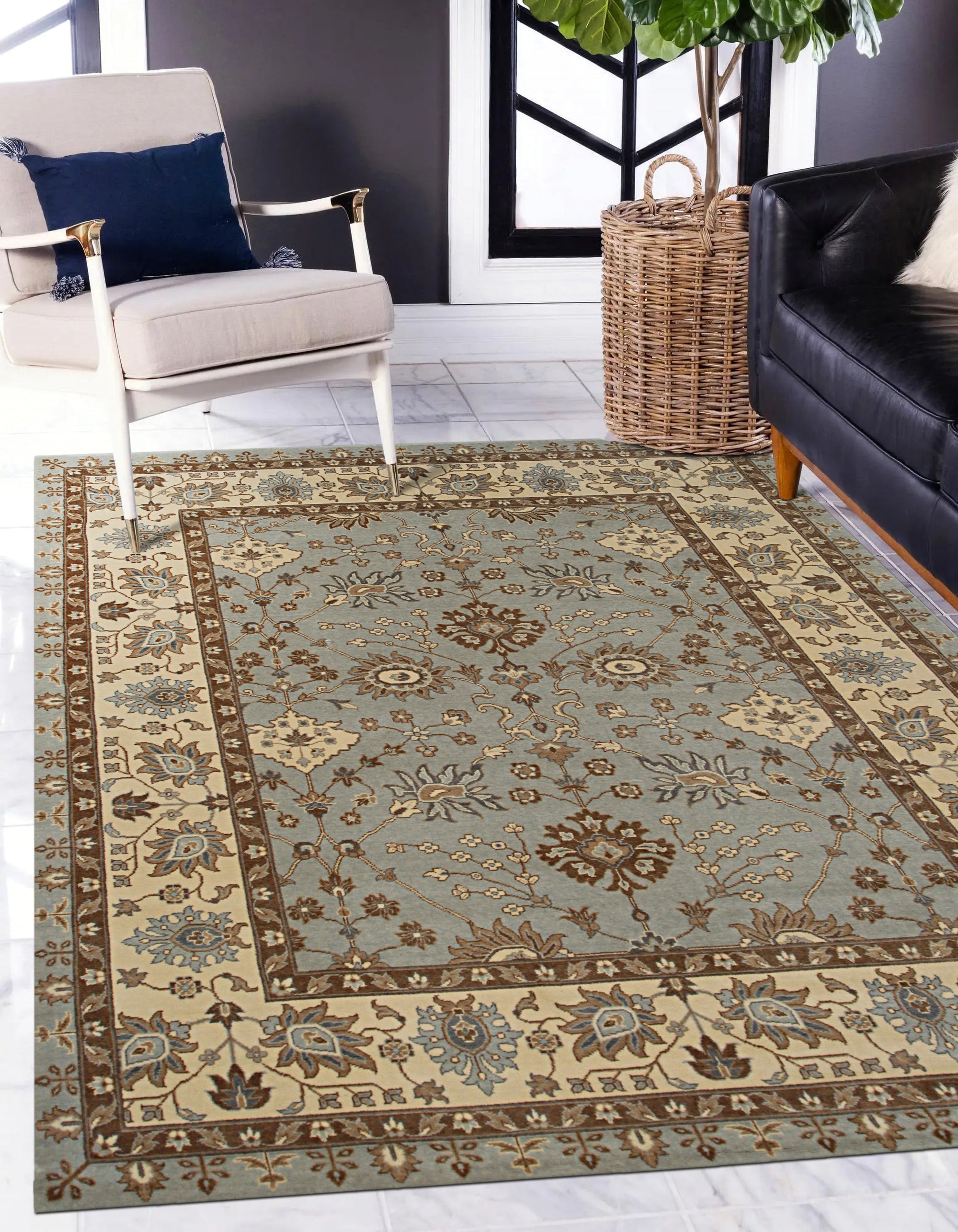 Artisan Oushak Light Blue Hand Knotted Wool Rug, displaying intricate floral patterns in soft blues and creams, lending an airy, sophisticated touch to a well-lit living room setting.