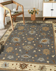 Bespoke Oushak Gray Hand Knotted Wool Rug, warm gray wool with a traditional Oushak design, lies flat on a light floor, its intricate pattern adding subtle elegance to the room.
