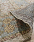 Classic Oushak Beige Hand Knotted Wool Rug, a beige wool rug hand-knotted with a traditional Oushak design, displayed in a bright living room setting.