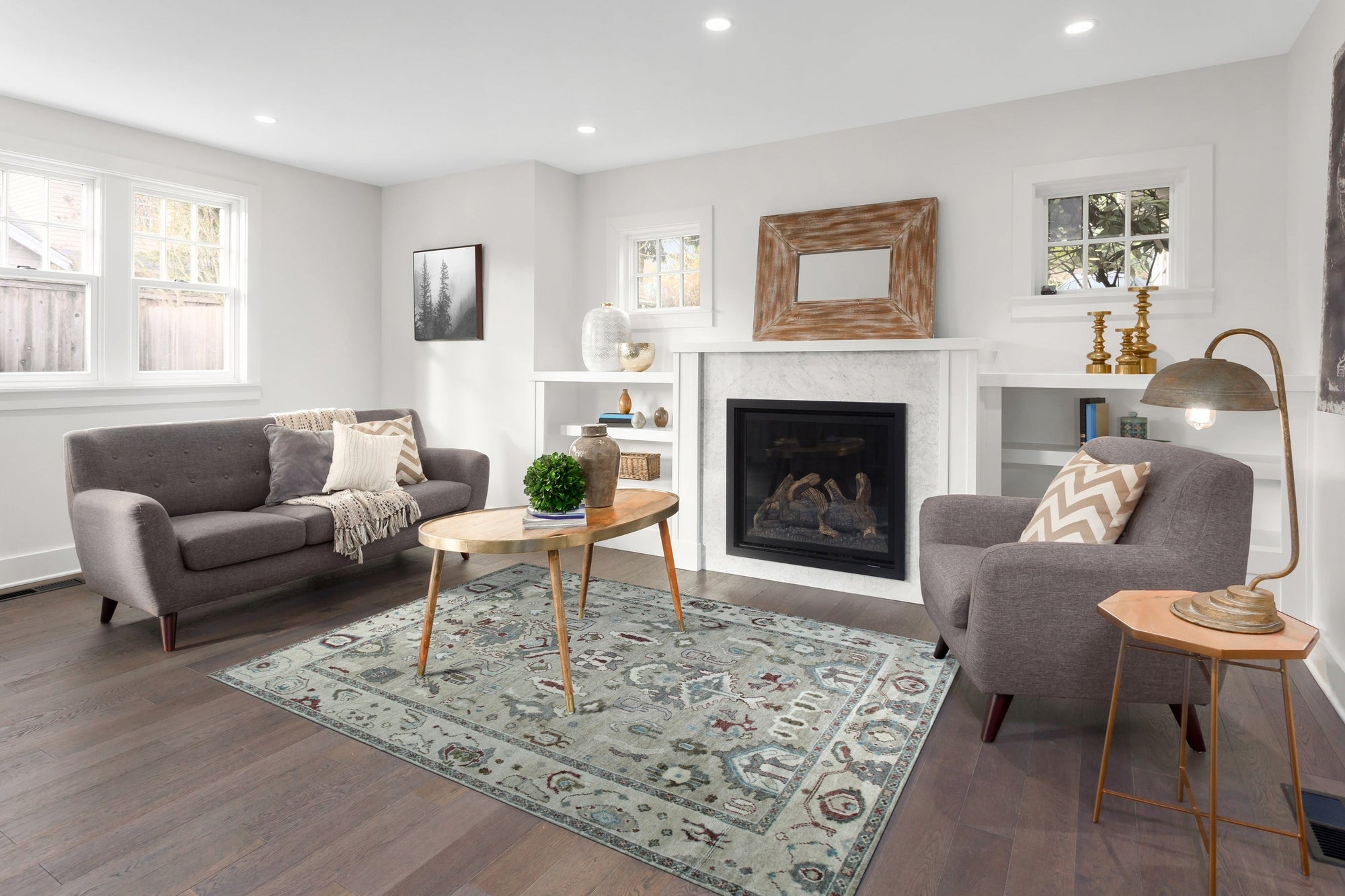 Versatile Oushak Ivory Hand Knotted Wool Rug, showcasing a creamy, warm ivory tone and intricate, traditional Oushak design details in a softly lit room setting.