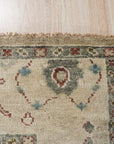 Versatile Oushak Ivory Hand Knotted Wool Rug, showcasing its intricate floral design and soft ivory tones in a bright, airy living space.