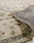 Here are a few options for alt text, considering the image position is 6:
 
 * Versatile Oushak Ivory Hand Knotted Wool Rug graces a bright living room, its soft ivory tones complementing the modern decor.
 
 * Hand-knotted wool rug, the Versatile Oushak Ivory, anchors a seating area with its subtle pattern and plush texture.
 
 * Ivory wool Versatile Oushak rug adds warmth and elegance to a home interior, showcasing its intricate knotting and classic design.