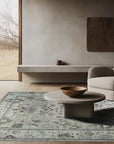 Versatile Oushak Ivory Hand Knotted Wool Rug, a soft ivory wool rug with a traditional Oushak design, grounding a light and airy living room setting.