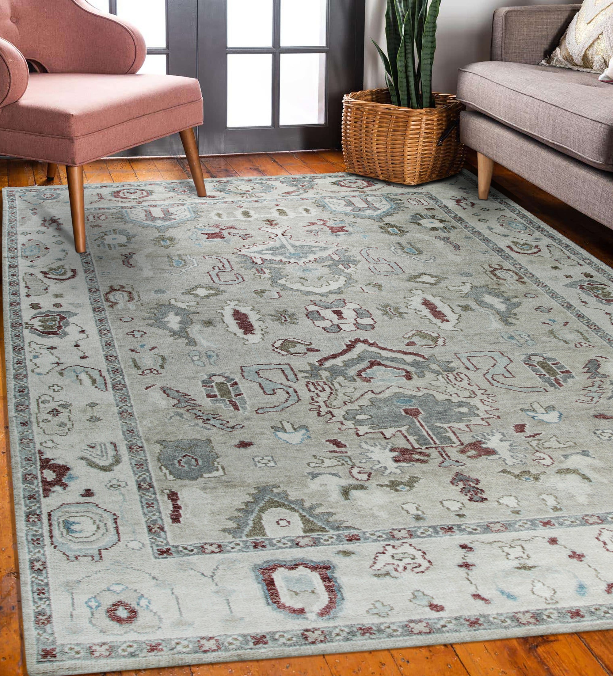 Versatile Oushak Ivory Hand Knotted Wool Rug, a serene expanse of creamy ivory wool detailed with a subtle, classic Oushak pattern, anchors a bright, sunlit living room.