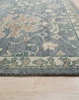 Beautiful Oushak Blue Hand Knotted Wool Rug, its intricate floral patterns and soft blue hues complementing a bright, airy living room setting.
