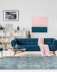 Beautiful Oushak Blue Hand Knotted Wool Rug, displaying intricate floral patterns in soft blues and creams, seen in a well-lit interior setting.