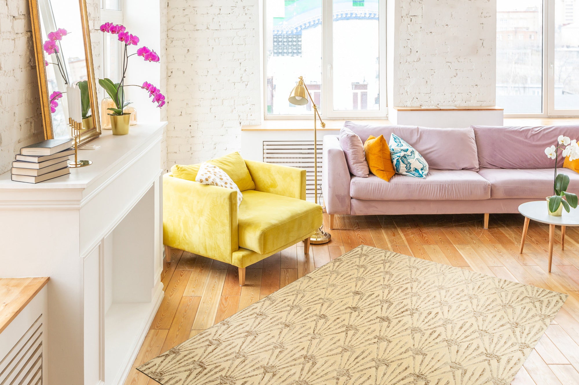 Chloe Trellis Ivory Hand Tufted Wool & Viscose Rug, its geometric trellis pattern rendered in soft ivory, anchored in a warmly lit living room with neutral furnishings.