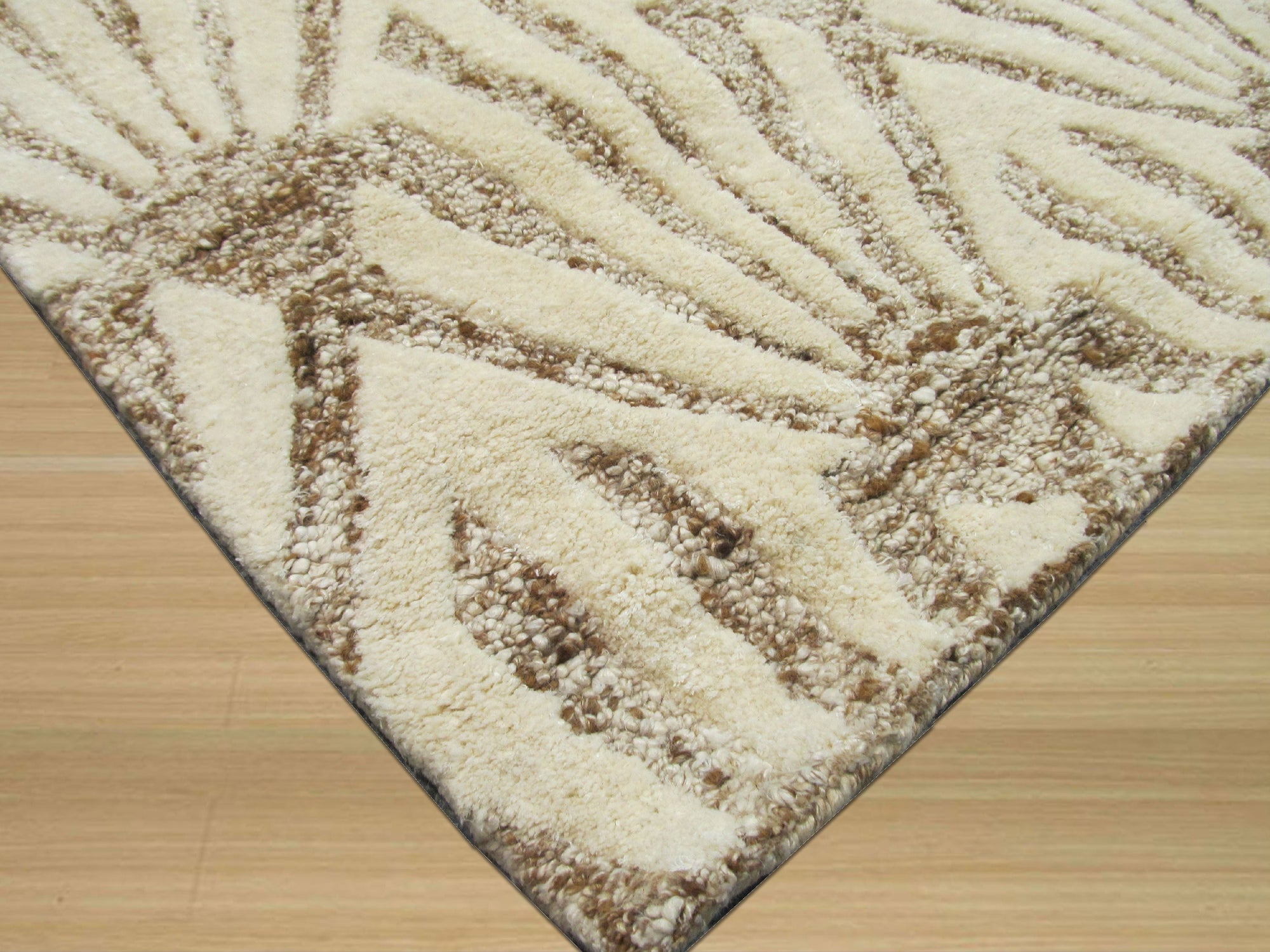 Chloe Trellis Ivory Hand Tufted Wool & Viscose Rug, its soft ivory wool and viscose pile featuring a subtle trellis design, seen in a bright, contemporary living room setting.