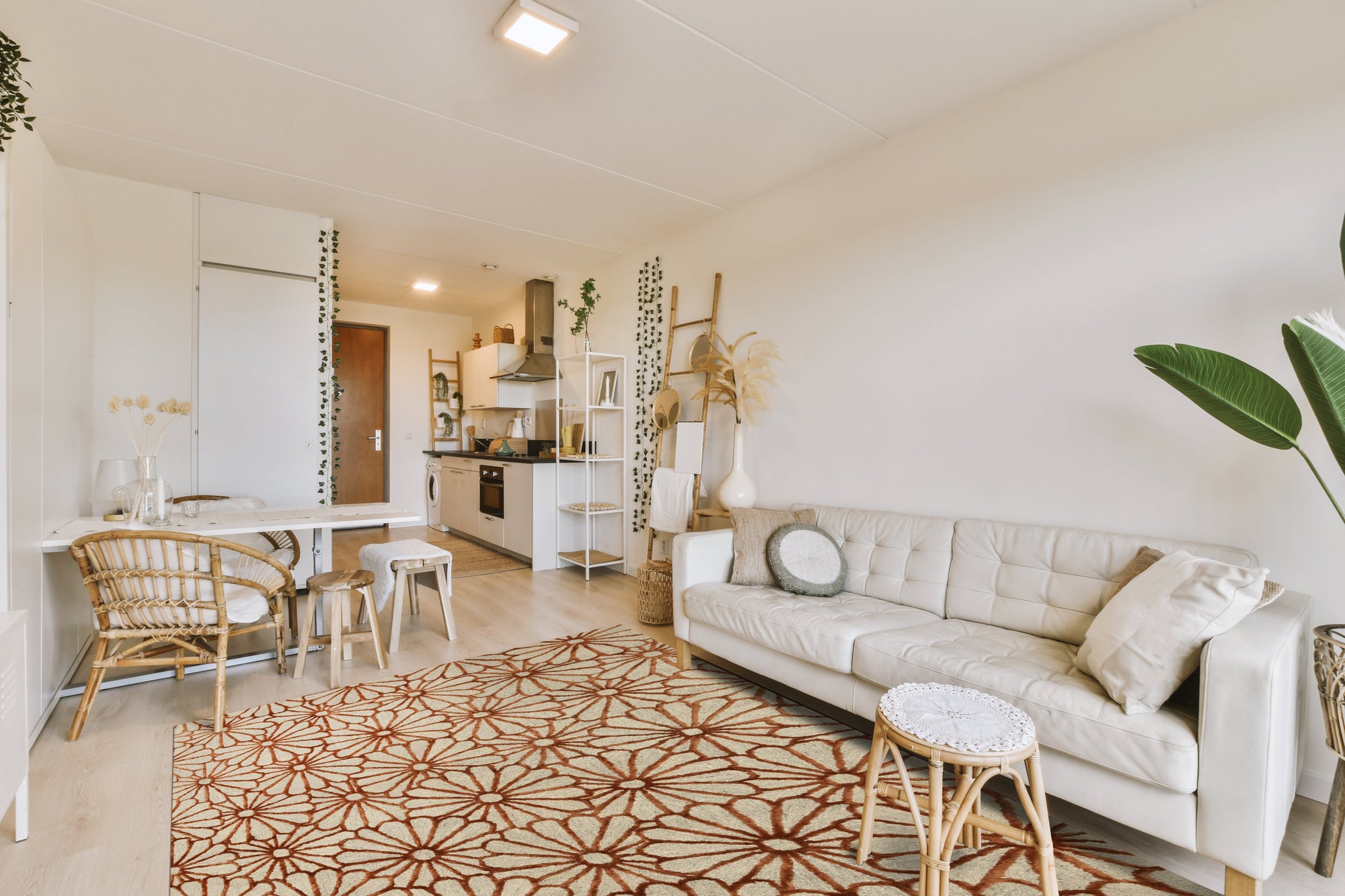 Nadia Trellis Ivory Hand Tufted Wool & Viscose Rug, a soft ivory rug with a subtle trellis pattern, showcased in a bright, minimalist living room.