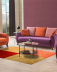 Celia Sophisticated Multicolor Hand Tufted Wool Rug, a vibrant blend of hues in a hand-tufted construction, displayed within a bright, modern living space.