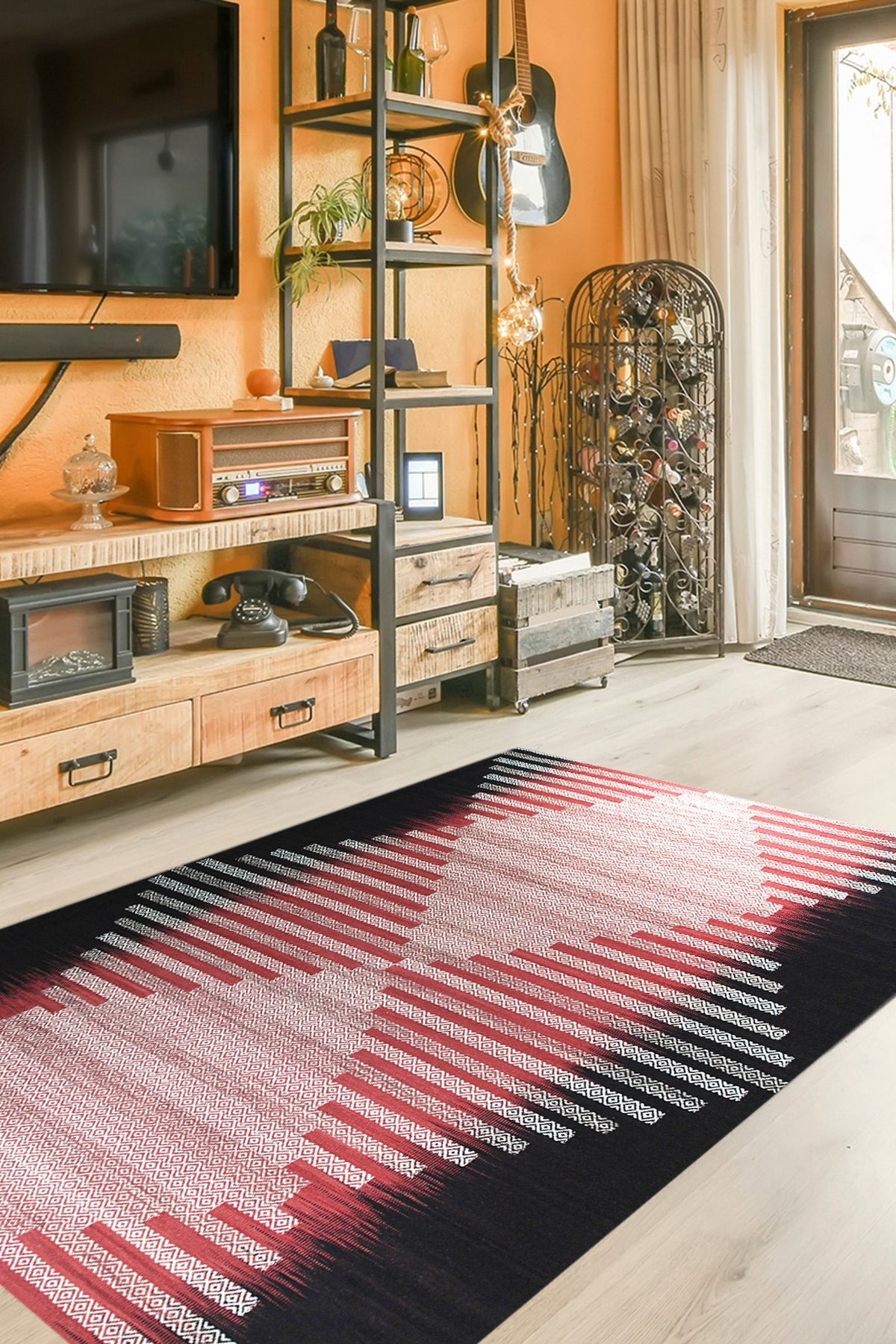 Dazzling Sleek Red Flatweave Wool Rug, its rich red hue and flatweave texture grounding a brightly lit living space with modern furniture and potted plants.